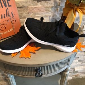 Skechers black slip on sneakers